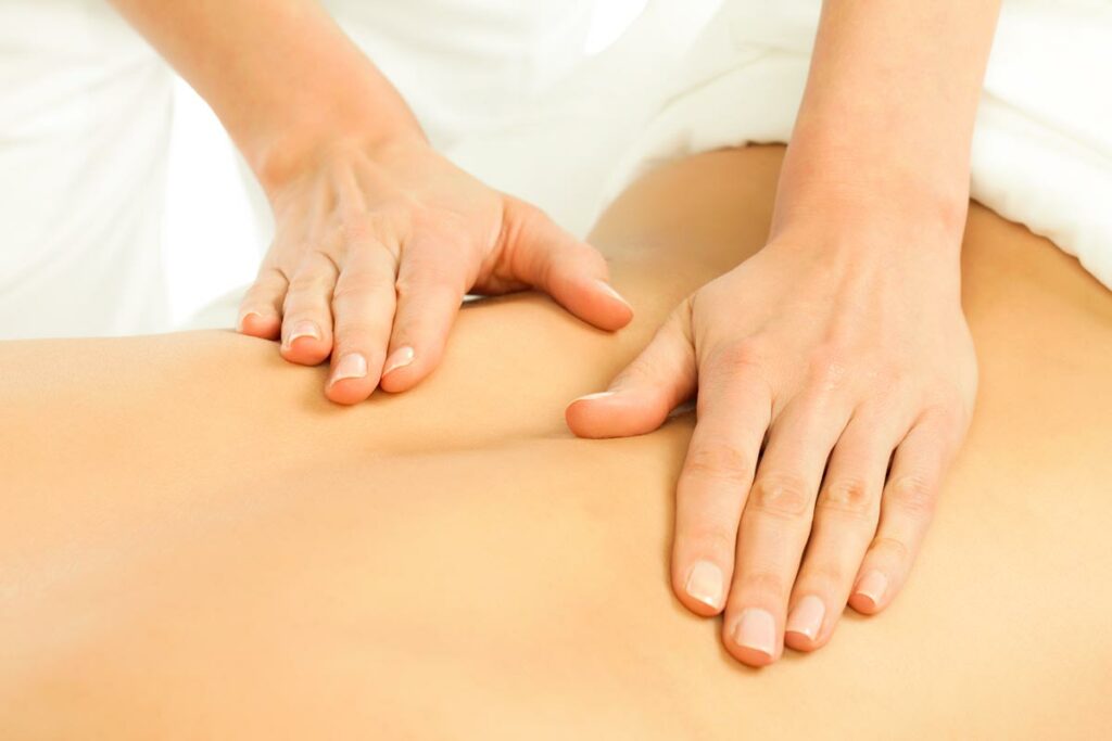 Hands giving a back massage